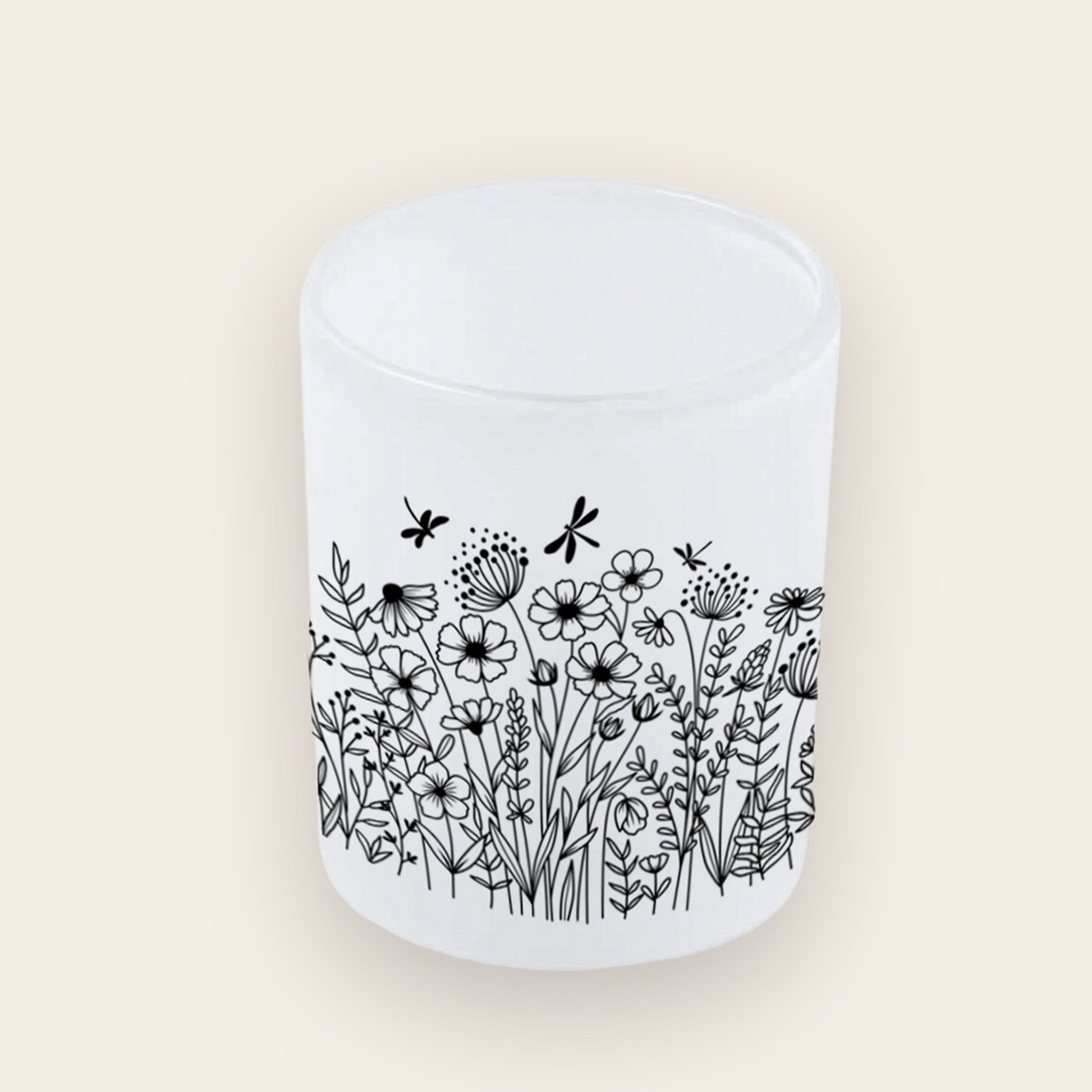 Satinierter Teelichthalter aus Glas mit schwarzen Wildblumen-Silhouetten.