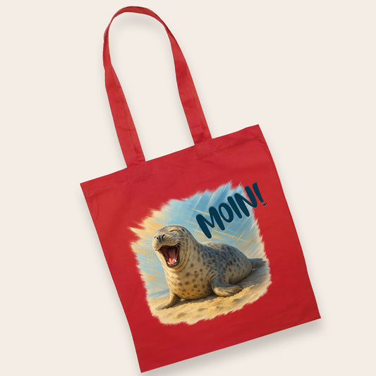 Rote Stofftasche mit hochwertigem Druck einer lachenden Robbe, ideal für Strand und Einkauf.